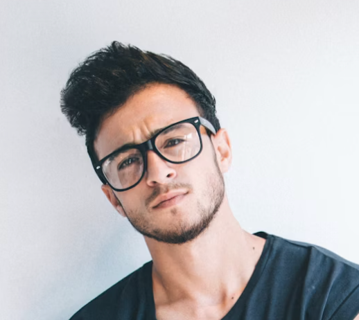 Man with glasses posing